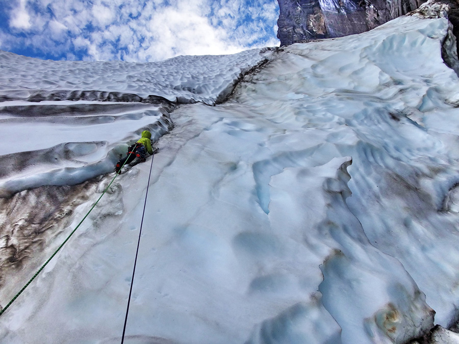 Climbing the starting serac during the first ascent of Metrophobia up the West Face of Apostel Tommelfinger in Greenland 